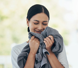Image showing Laundry, fresh and woman smelling clean clothes with a smile, peace and calm in a house. Happy, young and smiling cleaner cleaning clothing, linen and towel in the morning with happiness in a home