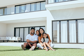 Image showing Happy family, real estate portrait and smile on grass outdoors, bonding and caring. Relax, love and father, mother and girls or children enjoying time together sitting on lawn in backyard of home.