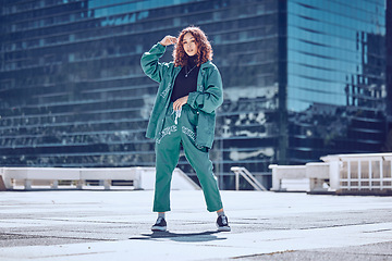 Image showing Fashion, style and woman on rooftop in city with stylish, trendy and modern outfit. Summer, freedom and carefree girl in town with creative, cool and designer clothes on weekend by urban building