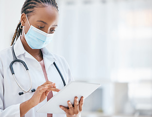 Image showing Doctor, tablet and covid in healthcare research, browsing or scheduling appointment at the hospital. African American medical professional woman or GP checking, test or cure for virus on touchscreen