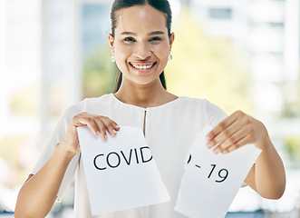 Image showing Covid, sign and business woman at the end of the pandemic, happy and smile for freedom from virus at work. Excited, portrait and corporate employee tearing paper for free from corona in an office