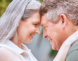 Image showing Love hug, forehead and senior couple bond, smile or happy on anniversary vacation for peace, trust or partnership. Romantic eye contact, marriage and elderly man and woman enjoy quality time together