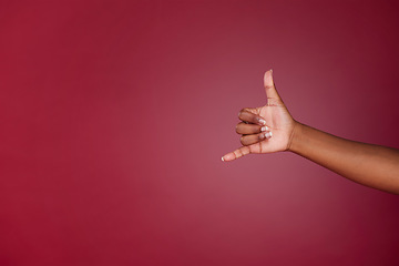 Image showing Shaka, sign and hand of a happy person with emoji for surfing, cool and relax against a purple mockup studio background. Marketing, advertise and hands for call me and happiness with mock up space