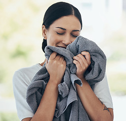 Image showing Clean laundry, happy woman and smelling towel, fresh scent and fabric, washing and linen textile at home. Young smile person, housekeeping service and domestic cleaning lifestyle