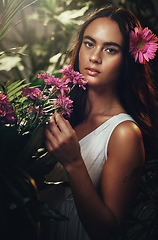 Image showing Beauty, flowers and woman in studio for skincare, makeup and product from nature, wellness and leaf cosmetics. Portrait, flower and girl model with jungle, plant and zen, relax and peony aesthetic