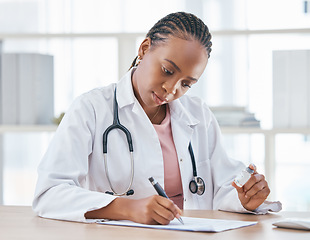 Image showing Medicine, vaccine and doctor writing notes in her office while while preparing a vial for a patient, Healthcare, vaccination syringe and black woman doing inspection on a medical product in hospital.