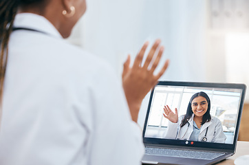 Image showing Online meeting, video call and doctors talking on a laptop in office in a hospital with technology. Wave, healthcare and medical professionals discussing medicine, treatment or surgery on a computer.