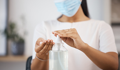Image showing Covid, hands and woman with sanitizer to clean, disinfect and prevent covid 19. Hygiene, disinfection and girl with face mask and bottle of antibacterial alcohol gel for bacteria, germs and sickness
