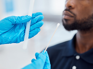 Image showing Doctor hands, compliance and a covid test with black man with testing kit in a clinic or hospital. Safety, medical pcr and healthcare hand, glove or corona check before with cotton swab and test tube