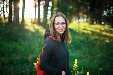 Image showing woman walking early in summer forest area