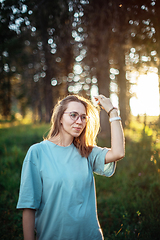 Image showing woman walking early in summer forest area