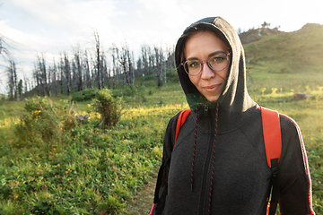 Image showing woman walking early in summer forest area