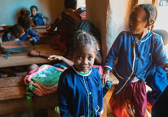 Image showing Happy Malagasy school children students in classroom. School attendance is compulsory, but many children do not go to school.