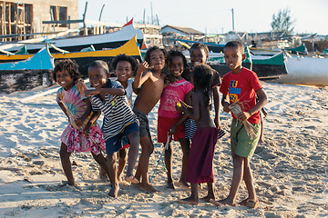 Image showing Group of Malagasy children frolicking on the beach near the fishing village of Anakao.