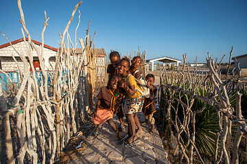 Image showing Group of Malagasy children frolicking on the beach near the fishing village of Anakao.