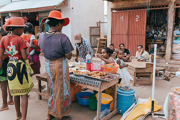 Image showing Street food seller on the main street in Miandrivazo. In Madagascar, people usually eat on the street.