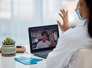 Image showing Video call, healthcare and doctor consulting with a man on a laptop for health, help and advice at a hospital. Medical, consultation and patient with wave while doing telehealth with a nurse on tech