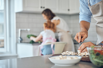 Image showing Food, hands and man cooking for family in kitchen with healthy, raw and vegetables in their home. Parents, multitasking and bond with girl while cleaning, talking and prepare a health meal or salad