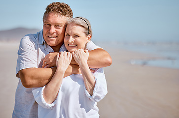 Image showing Happy senior couple on beach, portrait on Sydney seaside holiday in ocean vacation lifestyle. Mature man hugging elderly wife on retirement trip, summer love in sunshine and people smile together