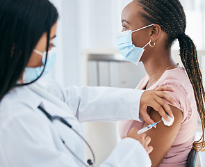 Image showing Doctor, covid mask and vaccine of a woman patient with medicine injection in hospital or clinic. Healthcare, nurse and consulting medical worker with health vaccination and black woman consultant