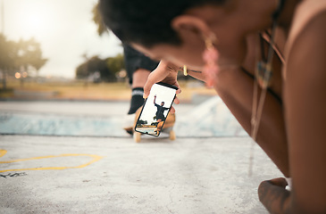 Image showing Phone, skate and photograph with a woman recording a man skater at the skatepark for fun or recreation. Mobile, skating and picture with a male athlete riding a board while a friend is filming