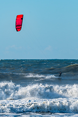 Image showing Kitesurfer riding ocean waves