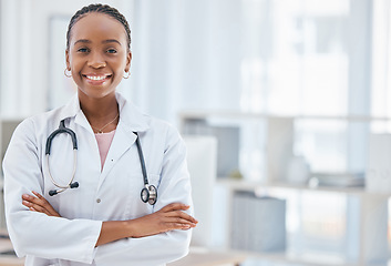 Image showing Smile, medical and arms crossed with portrait of doctor and mockup in consulting room for innovation, surgery and medicine. Healthcare, help and vision with black woman in hospital for pandemic virus