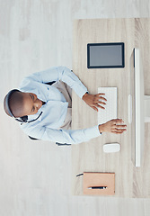 Image showing Call center, customer service and telemarketing with a woman consultant working in her office from above. Contact us, crm and support with a female consulting over a headset to give advice at work