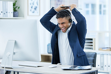 Image showing Stress, angry or shouting call center businessman breaking computer keyboard in crm consulting fail, sales deal risk or 404 glitch. Mad, screaming or crazy customer support agent in technology smash