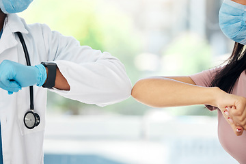 Image showing Covid, doctor and woman elbow bump hello for covid compliance, safety and social distancing in hospital. Safety, nurse and patient arm greeting during corona pandemic in consultation room for health