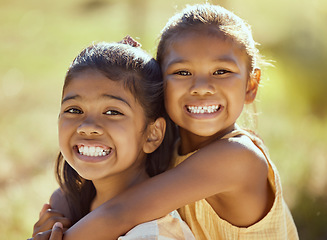 Image showing Love, kids and girls hug in nature outdoors while siblings happy bonding together. Portrait of children, best friends smile and relax happiness outdoors for healthy peaceful lifestyle on vacation