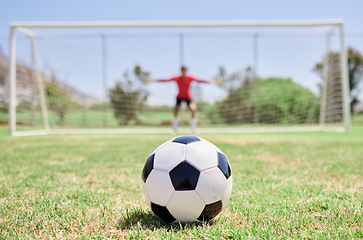 Image showing Soccer ball, football field and goalkeeper ready for defense to stop goals for penalty kick game on soccer field, grass pitch and sports stadium. Football player, goalie challenge and target training