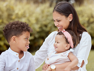 Image showing Family, happy and children with a mother having fun with tongue out gesture in a nature park. Kids, comic and funny quality time of a mom, boy and baby together with happiness, love and youth