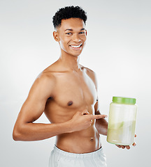 Image showing Strong man advertising protein powder supplement, healthy exercise diet drink and energy on studio background. Portrait of bodybuilder ambassador, sports nutrition container or healthy muscle product