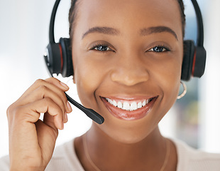 Image showing Contact us, portrait and black woman in customer support in call center with a microphone for communication. Smile, telemarketing or happy insurance sales agent talking, speaking and helping clients