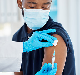 Image showing Doctor hand, syringe and covid vaccine, face mask and safety against virus, medicine and healthcare. Black man, patient and medical expert with covid 19 vaccination ro compliance at a health clinic