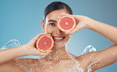 Image showing Skincare, health and grapefruit with woman in studio portrait mock up for clean face advertising or marketing. Skin wellness, detox and vitamin c fruits for vegan beauty facial product on blue mockup