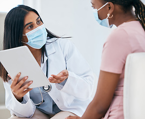 Image showing Black woman covid, doctor tablet results and talking in hospital office for healthcare report discussion. Woman digital medic, corona technology for diagnosis and medical conversation for clinic help