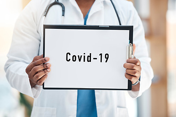 Image showing Doctor, covid 19 paper sign and clipboard, poster and information report for healthcare, global pandemic and hospital consulting. Medical worker hands holding marketing note for corona virus disaster