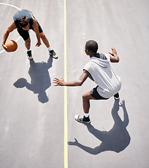 Image showing Basketball and basketball player on the court from above for a game during summer for fitness and sport. Sports, active and youth playing competitive match for cardio, stamina and tournament