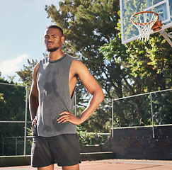 Image showing Basketball, black man and fitness on basketball court in the park, break after game with sports and serious in portrait. Strong, cardio and endurance and rest with sweat after sport training outdoor.