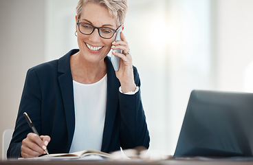 Image showing Mature business woman, phone call and notebook writing in company finance, investment and stock market sales negotiation. Smile, happy and talking financial broker on laptop or mobile tech networking