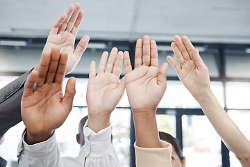 Image showing Hands, teamwork and motivation with a business man and woman group raising a hand in unity or solidarity. Meeting, goal and collaboration with a male and female employee team cheering in celebration