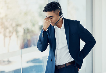 Image showing Businessman, headache and call center in burnout, stress or depression for consulting or telemarketing at the office. Man in contact us, customer service or support suffering with mental health issue