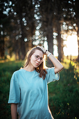 Image showing woman walking early in summer forest area