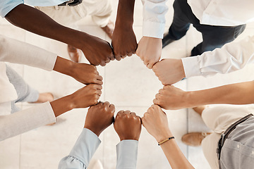 Image showing Diversity, solidarity and hands of business people in circle for teamwork, collaboration and synergy for team building in a corporate office. Men and women group together for support, trust and power