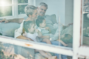 Image showing Window, sofa and grandparents and children watching tv, relax in home living room and streaming subscription television movie. Happy family love, quality time and elderly people bond with grandkids