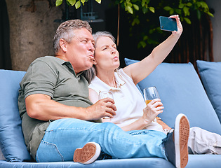 Image showing Phone, love and old couple take a selfie on holiday vacation in Amsterdam for bonding while drinking wine. Retirement, traveling and happy woman enjoys taking pictures with senior partner outdoors