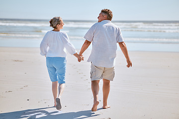 Image showing Senior couple, beach and retirement vacation walking, talking and happy about fitness, summer and travel together. Man and woman show happiness, love and marriage support on nature holiday by water