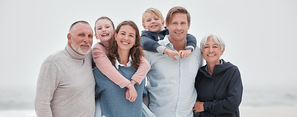 Image showing Family, children and beach with parents, grandparents and kids outdoor together while on holiday or vacation. Travel, love and bonding with a senior man, woman and grandkids spending time on a coast